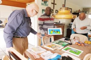 Bro. Henk Rolvers is showing his painting to us